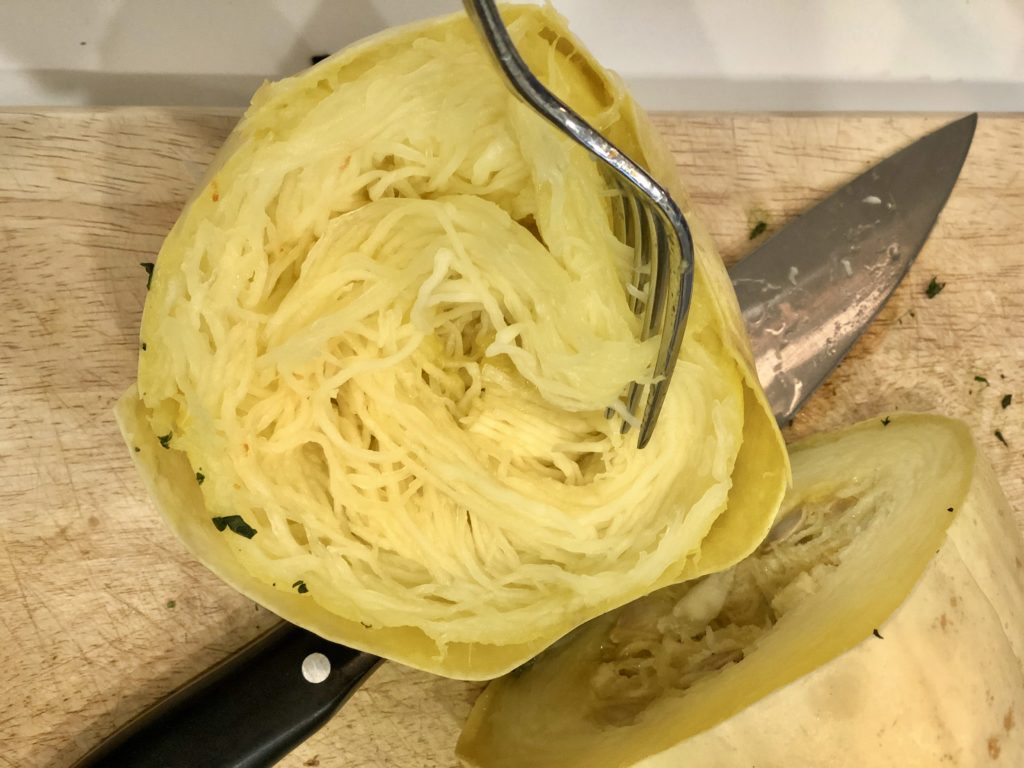 Cooked spaghetti squash cut in half